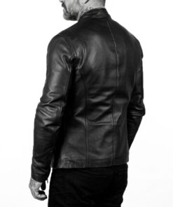 Rear view of a man wearing the Ionic black leather biker jacket, showcasing the clean back panel and shoulder epaulets.